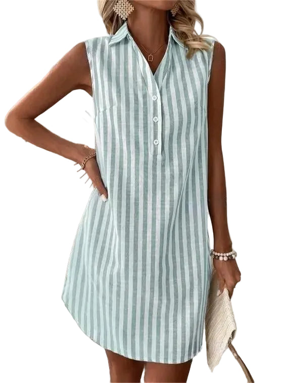 Sleeveless green and white striped shirt dress worn by model holding a clutch against a white background.