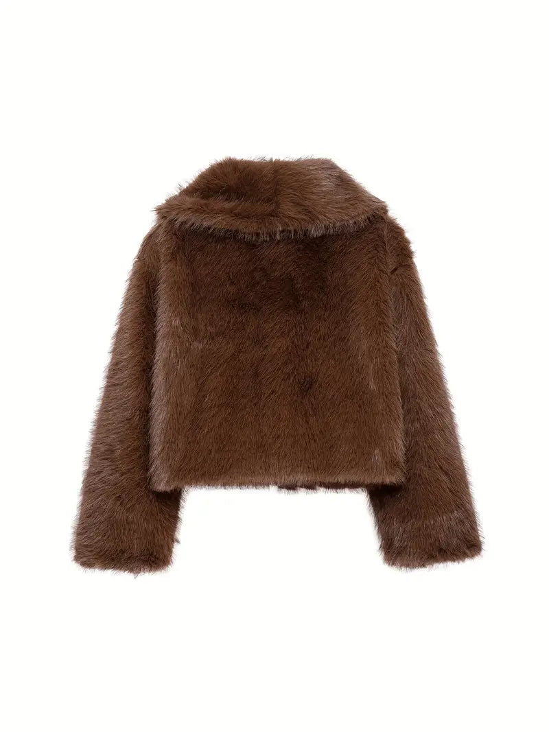 Back view of a brown fur jacket, highlighting its fluffy texture and sophisticated cut, on a white backdrop.