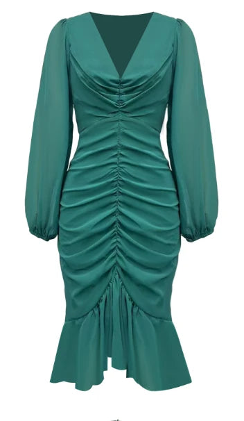 Front view of a green maxi dress with ruched detailing and long sleeves, isolated on a white background.