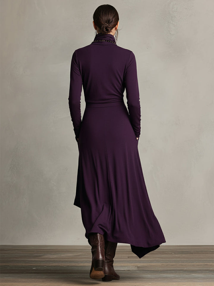 Back view of a purple stretch maxi dress with long sleeves, showing flowing design, in a studio setting.