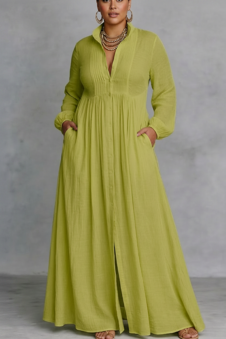 Lime green flowing button-front maxi dress with long sleeves in a studio setting.