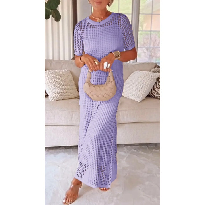 Lavender cut-out maxi dress worn indoors, model holding a woven beige handbag, standing in front of a beige couch.