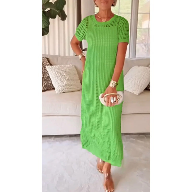 Bright green cut-out maxi dress worn indoors, model holding a white clutch, standing in front of a beige couch.