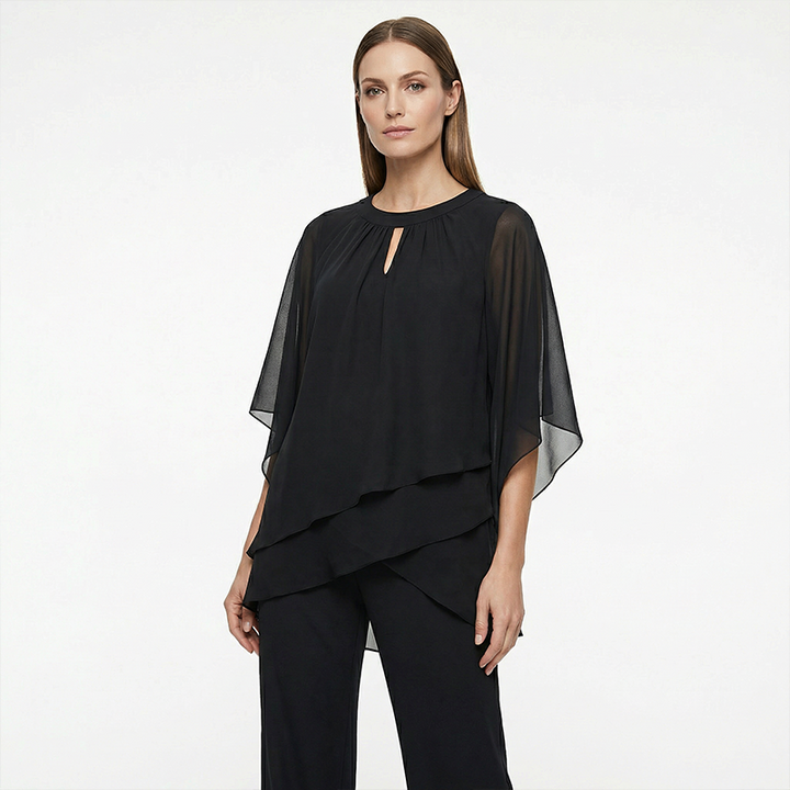 Black elegant outfit displayed against a white studio background.
