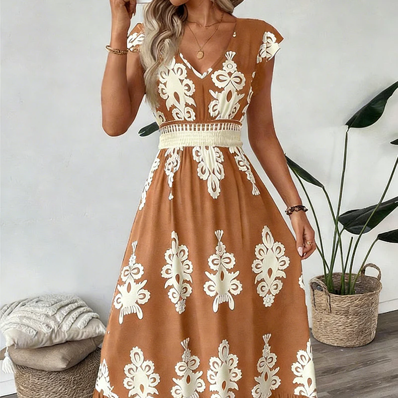 Brown elegant long dress with white floral patterns and a smocked waist, worn indoors with plants and cushions.
