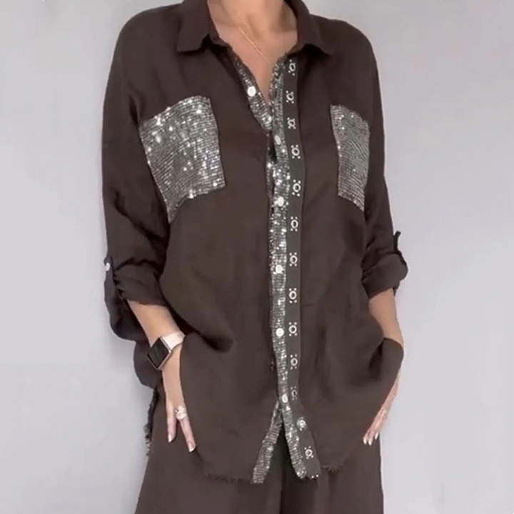 Dark brown elegant set with sequined pockets and buttons, presented in a gray studio environment.