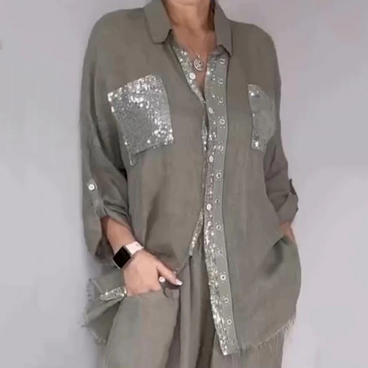 Olive green elegant set with sequin accents on pockets, modeled in a light gray studio.