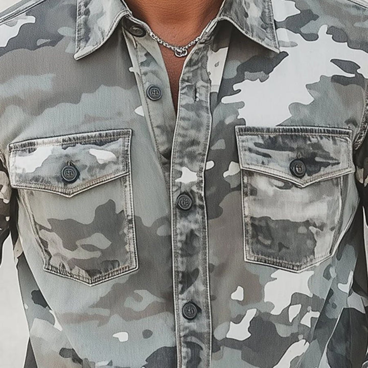 Close-up of gray camo shirt with front pockets and button details.