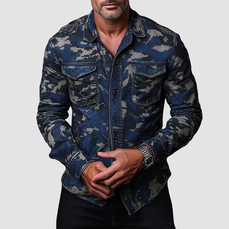 Man wearing navy camo shirt with button details and front pockets against plain background.